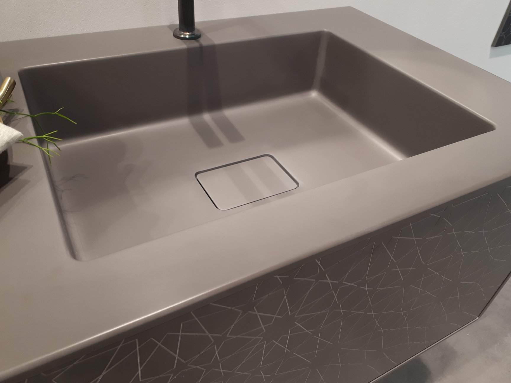 Modern integrated sink with a matte finish, featuring clean lines, a rectangular design, and a concealed drain for a sleek, minimalist look.