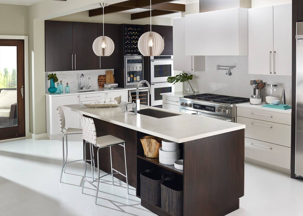 Contemporary kitchen with a spacious center island and stainless steel appliances, highlighting elegance and practicality.