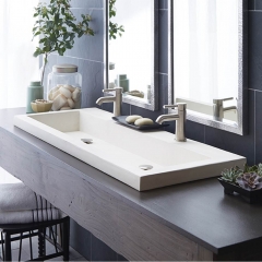 A bathroom featuring a sink and two mirrors, reflecting a clean and modern design aesthetic.