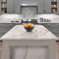 A contemporary kitchen showcasing pristine white marble countertops paired with sleek gray cabinets for a chic design.