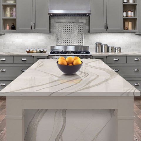 A contemporary kitchen showcasing pristine white marble countertops paired with sleek gray cabinets for a chic design.